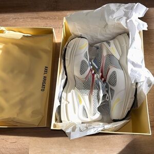 Axel Arigato White and Red Sneakers